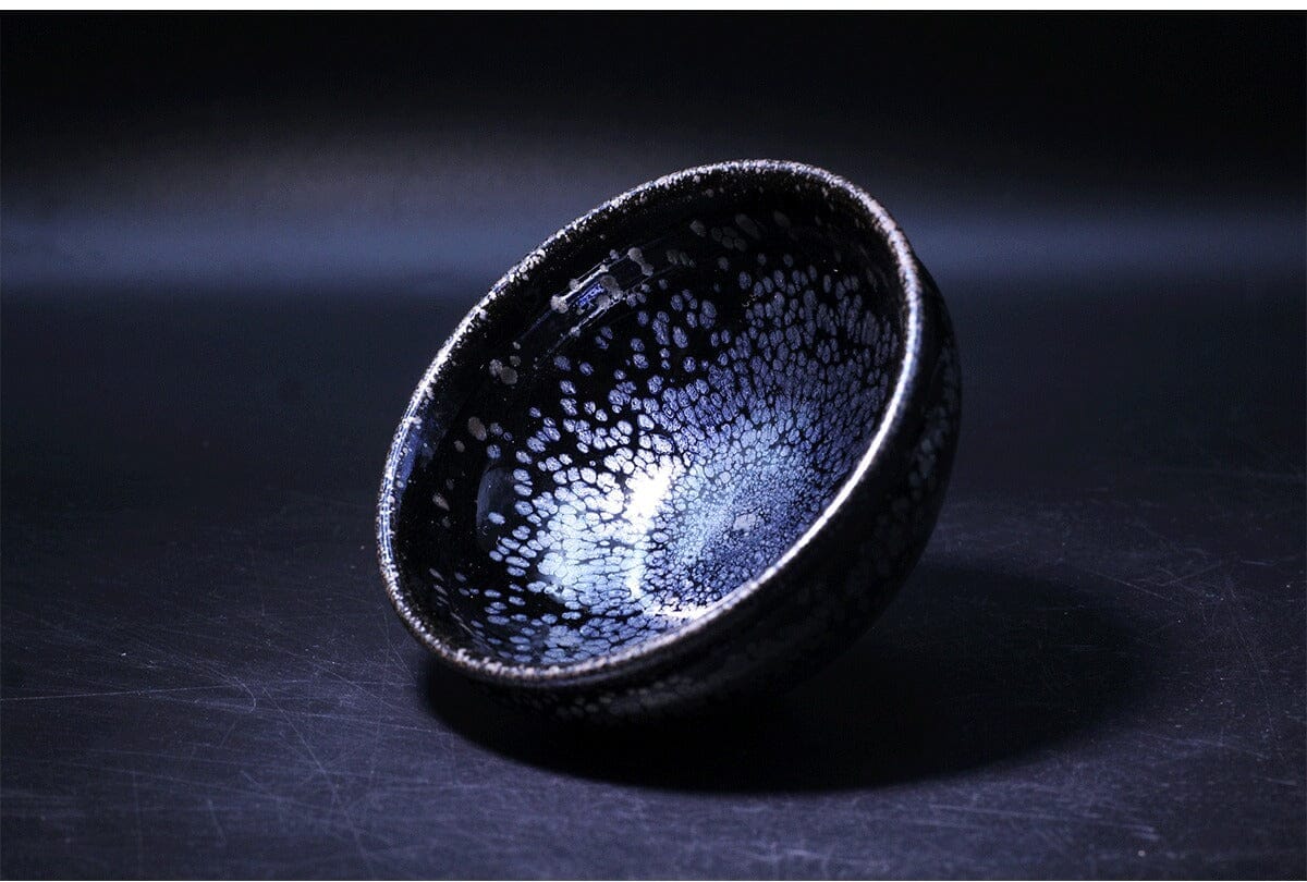 Who determines the value of Tenmoku bowls?