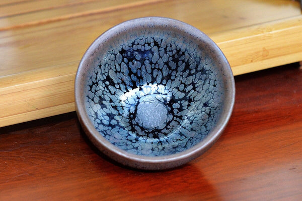 Jian bowl patterns: oil droplets and rabbit hair used to explain formation.