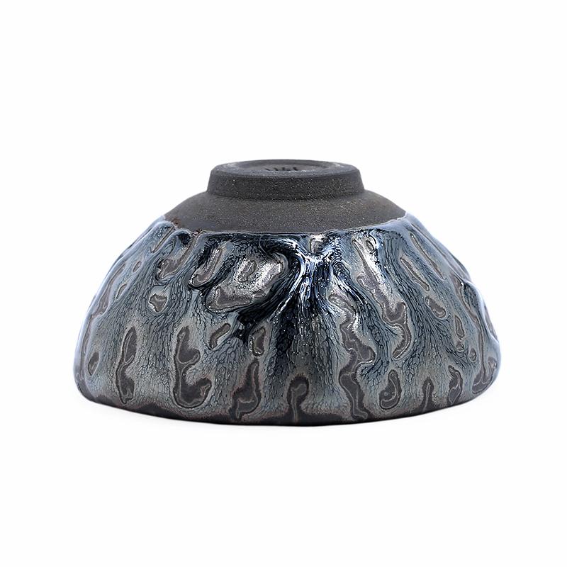 Inverted Oni tea cup showing the circular foot and underside for a condition check
